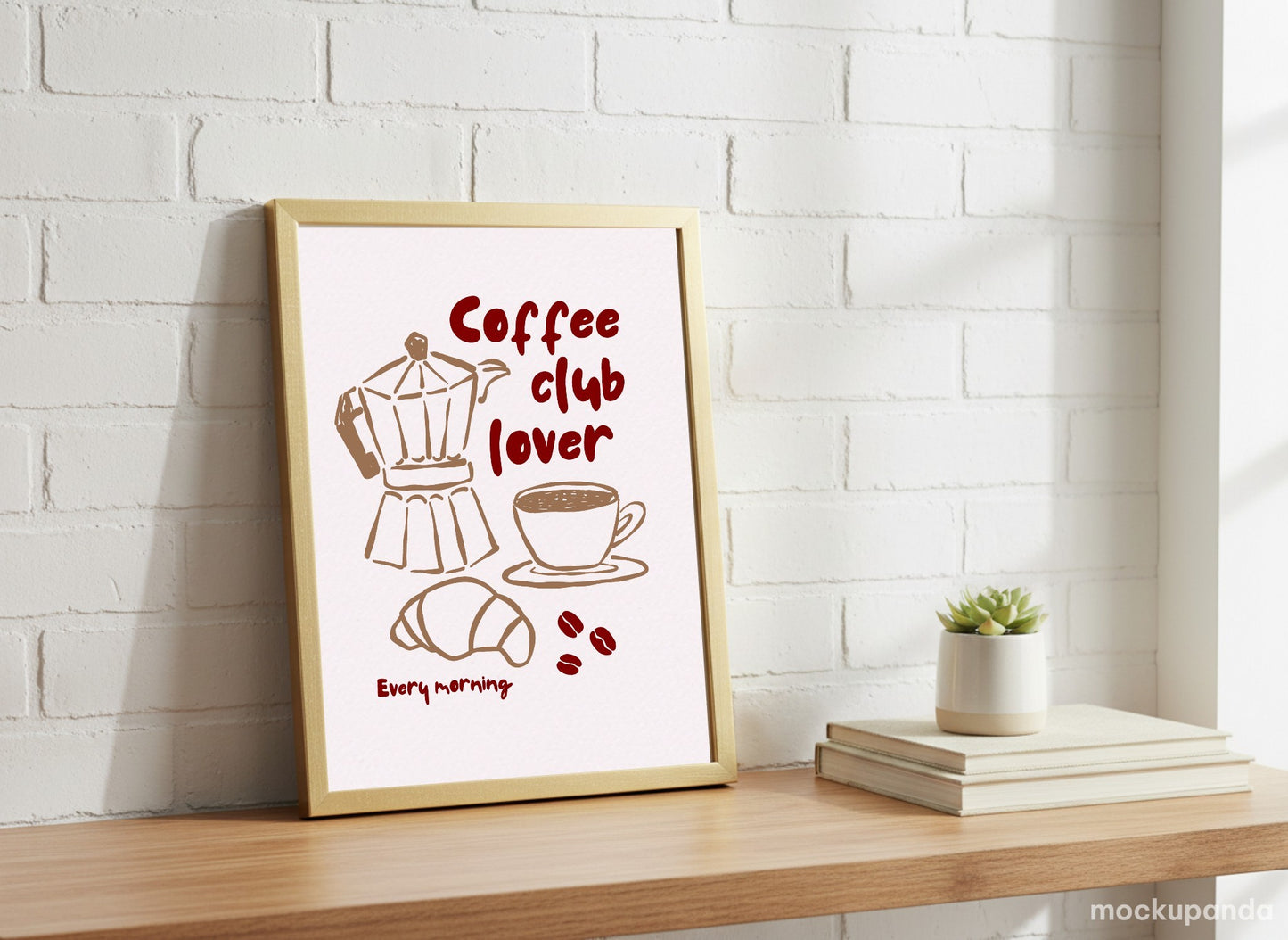 Framed artwork with coffee-themed design on a wooden shelf against a white brick wall.